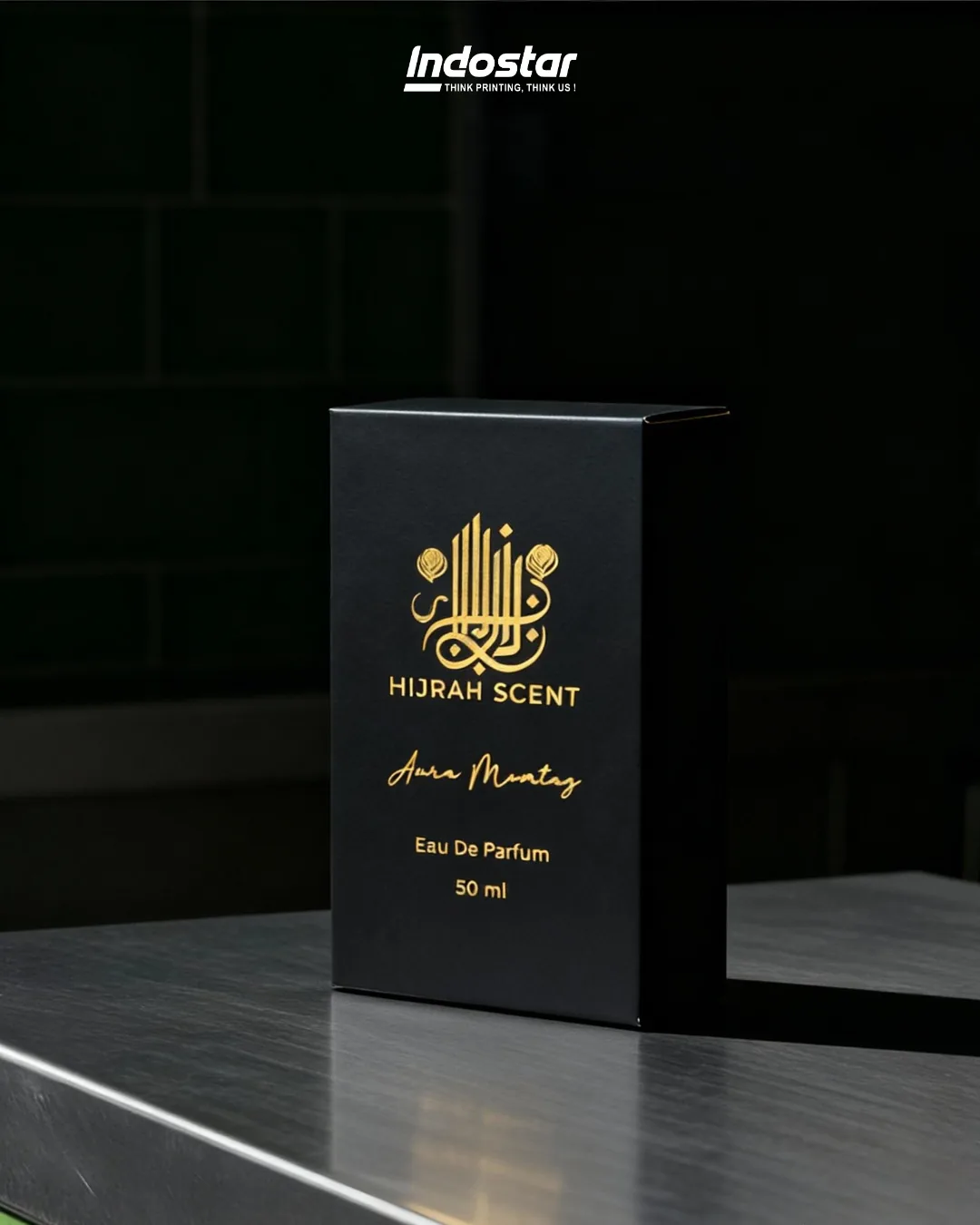 Kemasan hardbox parfum Hijrah Scent dengan hot stamp emas kaligrafi Islami